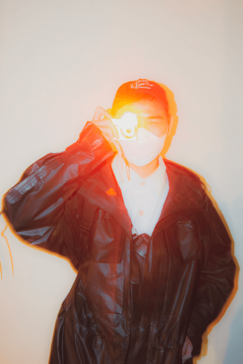 Portrait of a photographer with flash